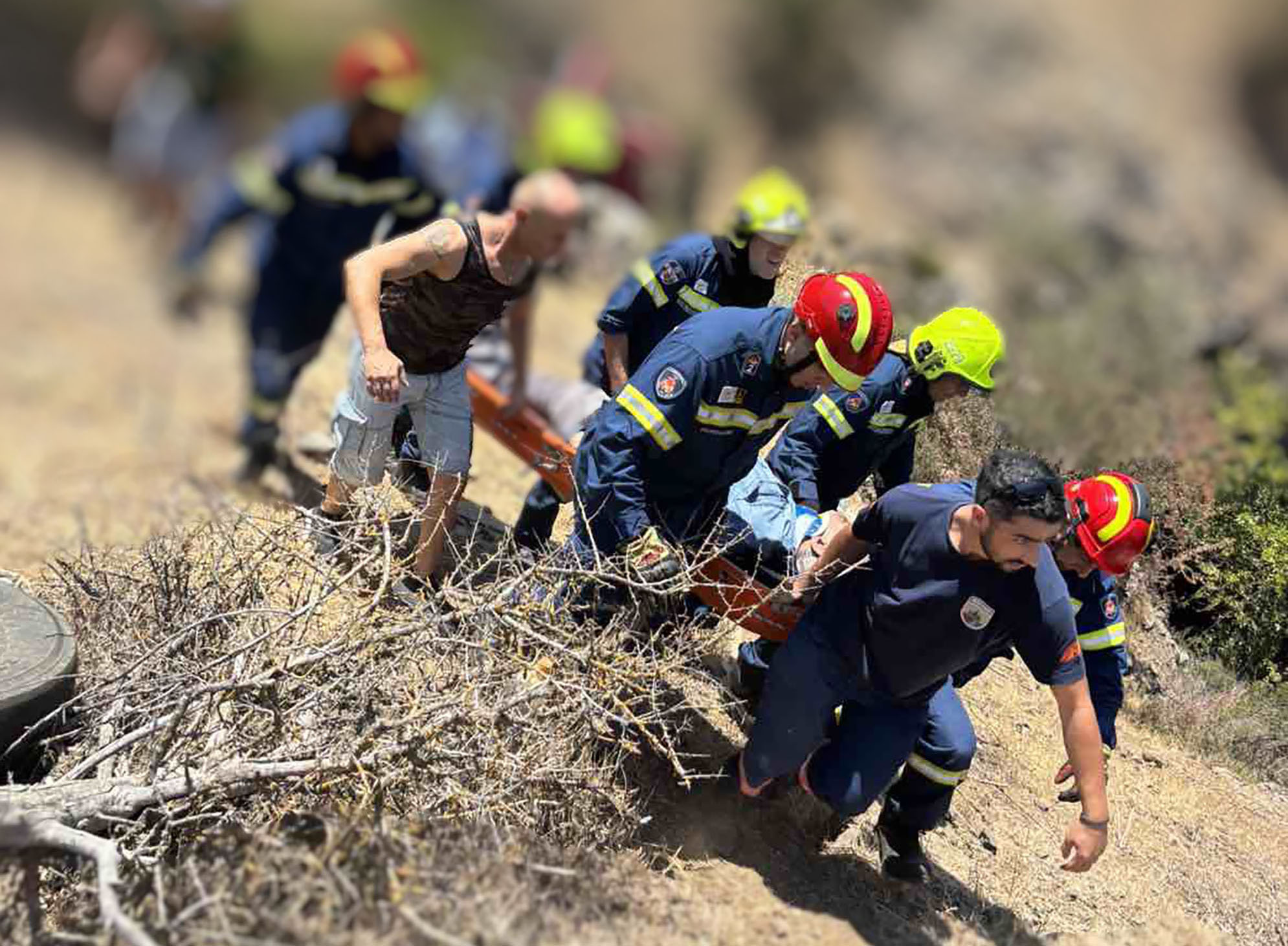 image Firemen rescue driver from 10m fall